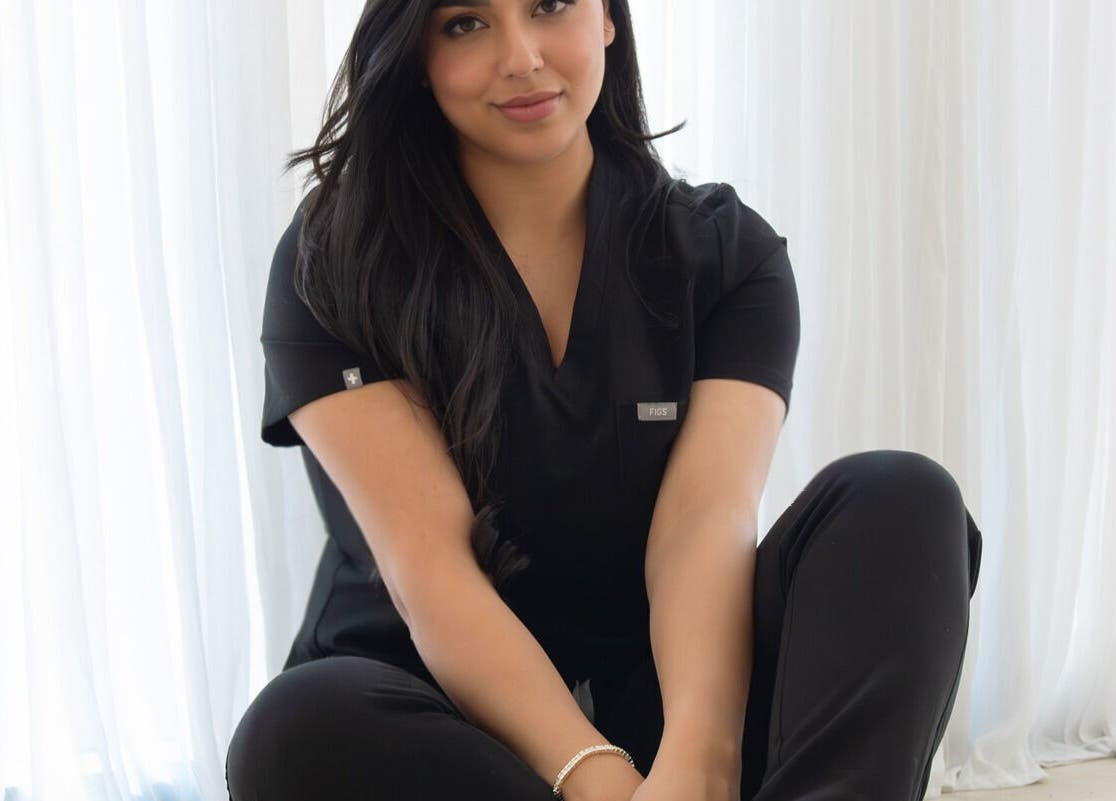 Relaxed ambiance at By The ML Aesthetics, Putney, New South Wales, AU with professional in black attire.