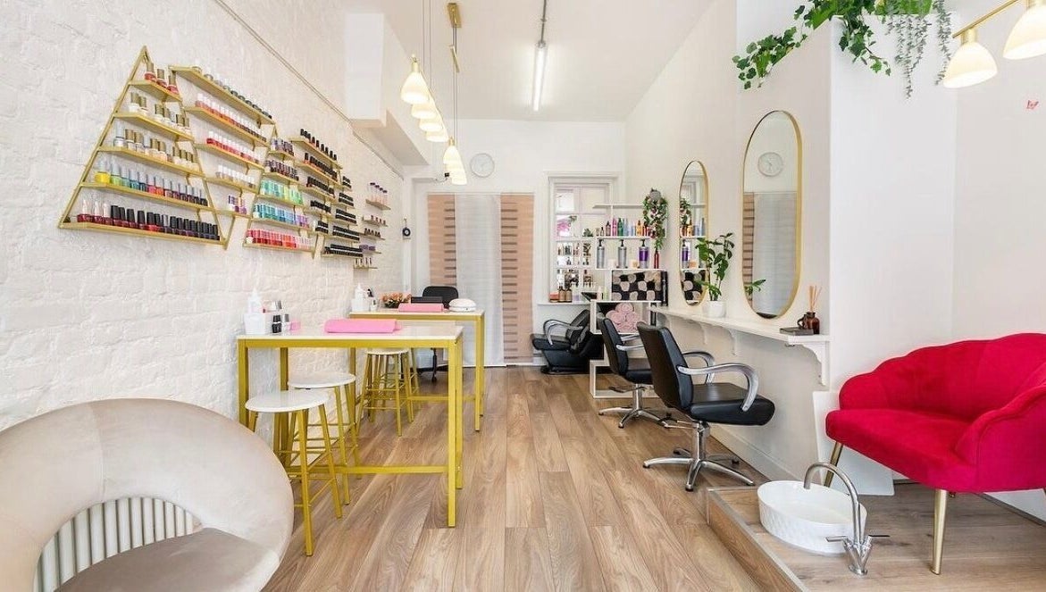 Modern interior of Arta Beauty Clinic, London, England, GB with stylish decor and nail polish display.
