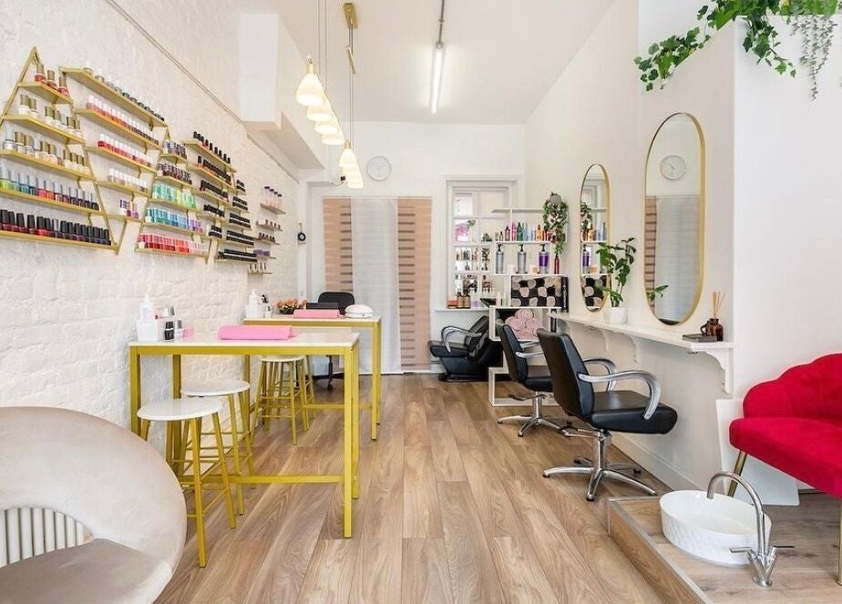 Modern interior of Arta Beauty Clinic, London, England, GB with stylish decor and nail polish display.