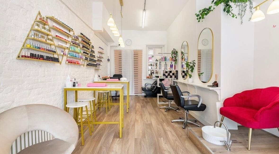 Modern interior of Arta Beauty Clinic, London, England, GB with stylish decor and nail polish display.