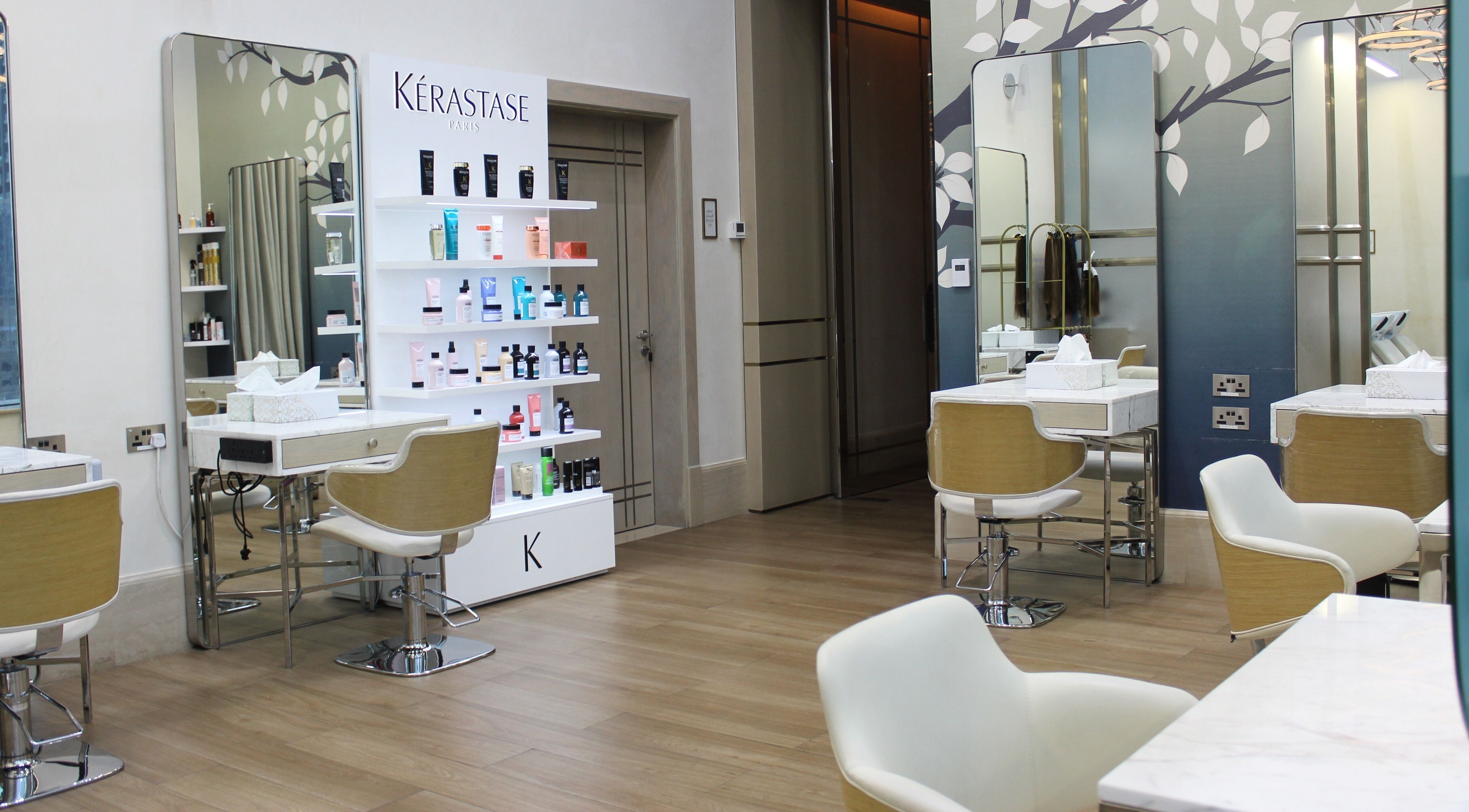 Chic styling area at Lobby Beauty Salon, Dubai, Dubai, AE with Kerastase products and modern decor.