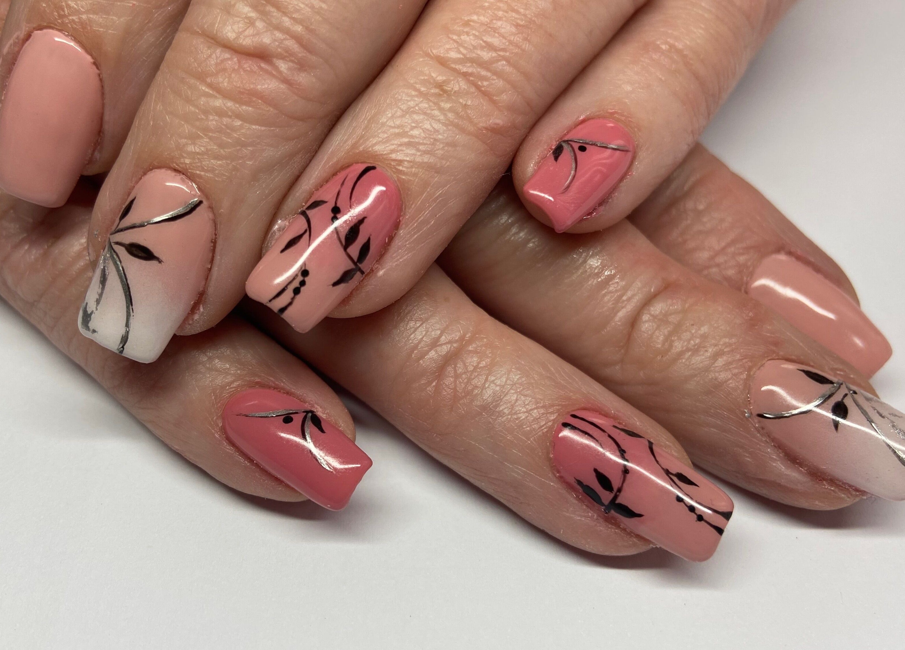 Stylish floral nail art at Shines Nail Art, Klerksdorp, North West, ZA, showcasing intricate designs.