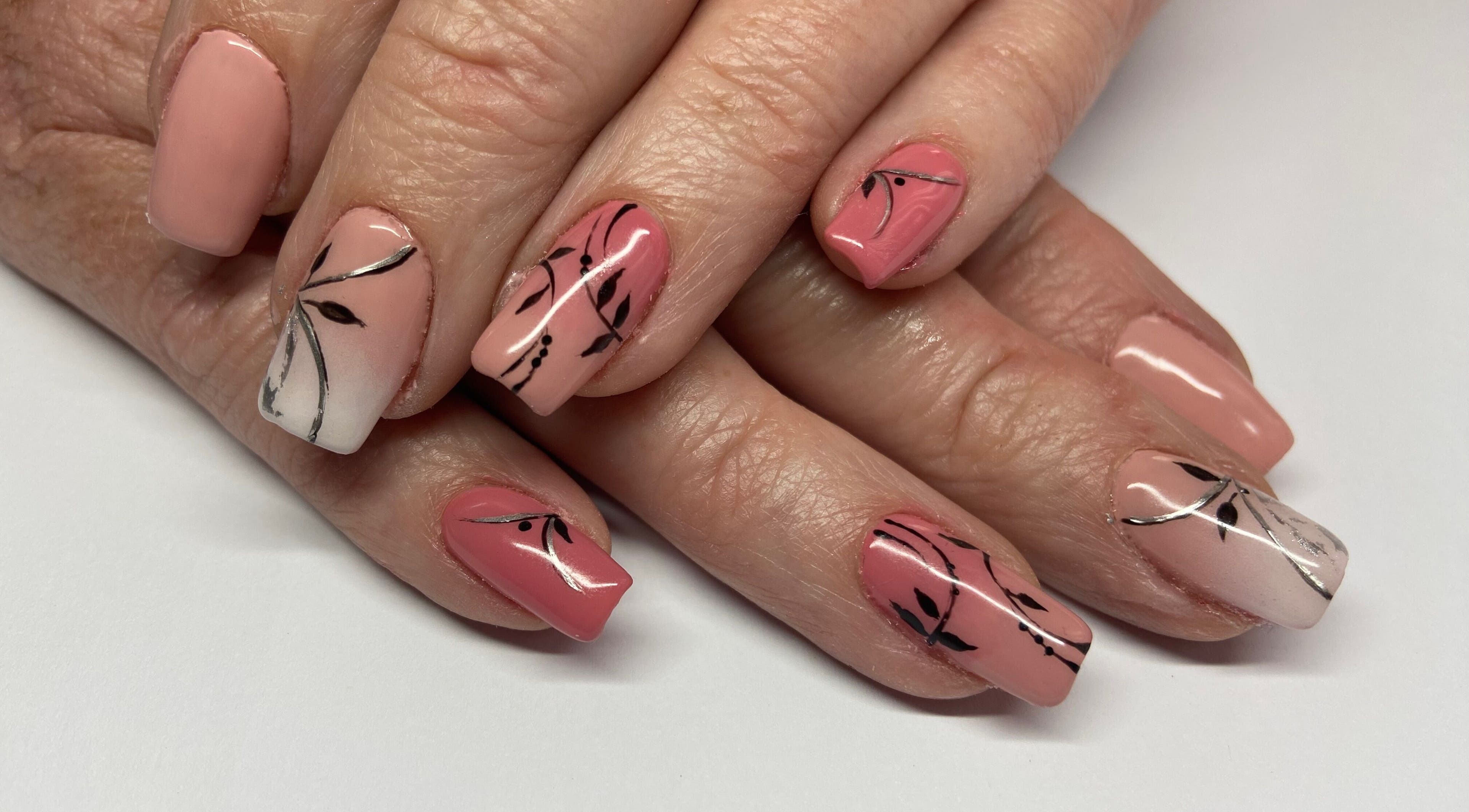 Stylish floral nail art at Shines Nail Art, Klerksdorp, North West, ZA, showcasing intricate designs.