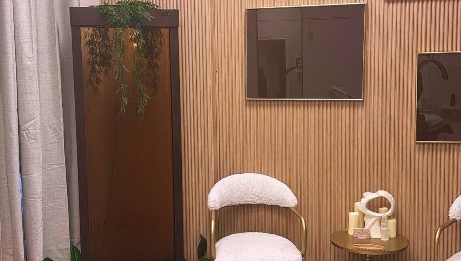 Modern, relaxing waiting area at NEWWAY Aesthetics, London, Ontario, CA with plush chairs and calming decor.