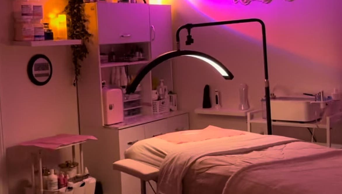 Cozy treatment room at NEWWAY Aesthetics in London, Ontario, CA with soft ambient lighting and beauty equipment.