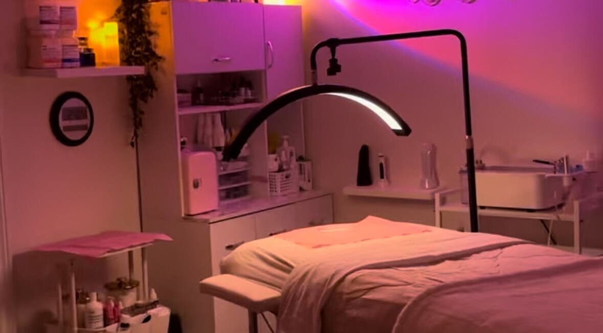 Cozy treatment room at NEWWAY Aesthetics in London, Ontario, CA with soft ambient lighting and beauty equipment.