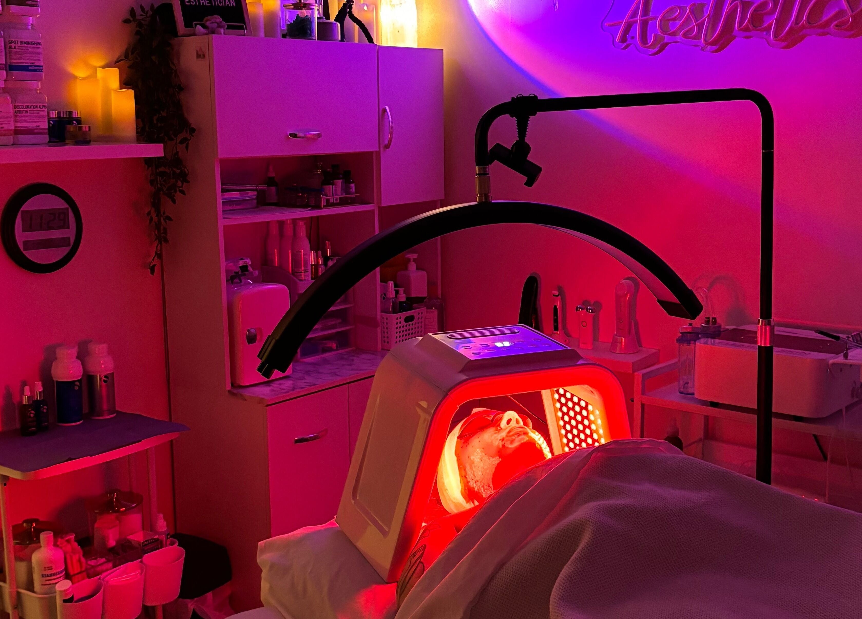 Relaxing LED light therapy at NEWWAY Aesthetics, London, Ontario, CA. Cozy room lit with calming hues.