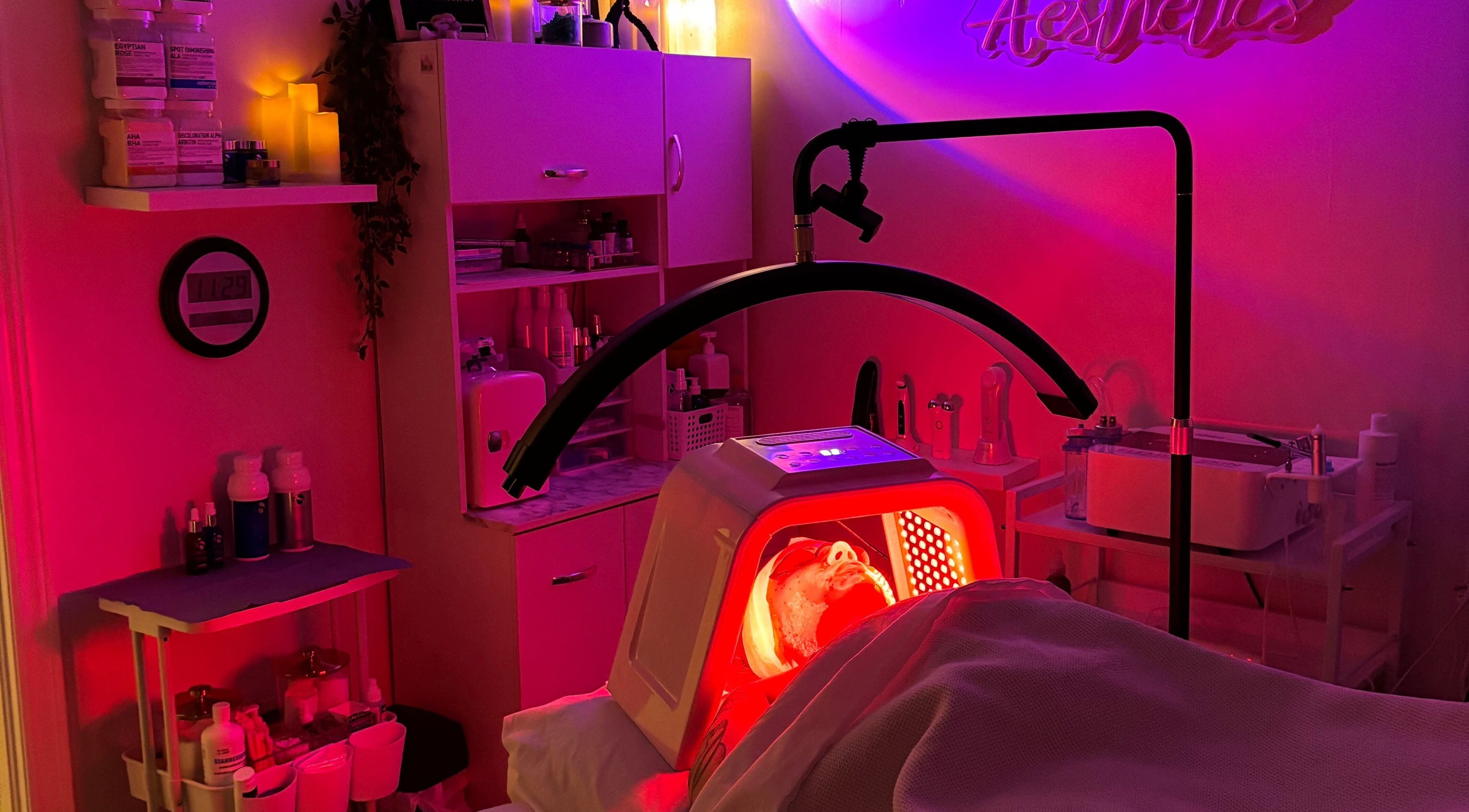 Relaxing LED light therapy at NEWWAY Aesthetics, London, Ontario, CA. Cozy room lit with calming hues.