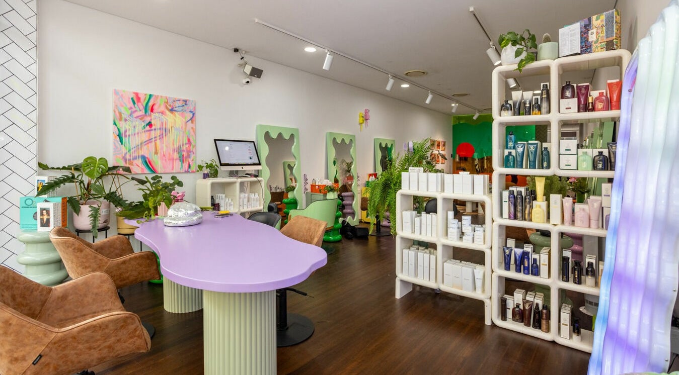 Stylish interior of Dollie and Stella beauty salon in Sydney, Australia, AU featuring vibrant decor and beauty products.