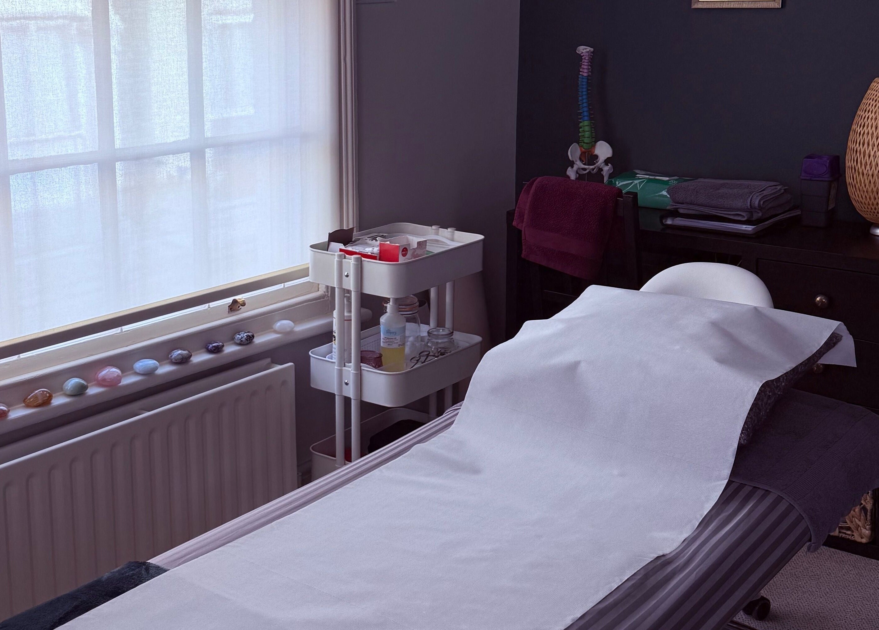 A tranquil massage room at Seeking Stillness Gravesend, Gravesend, England, GB, featuring a comfortable massage bed.