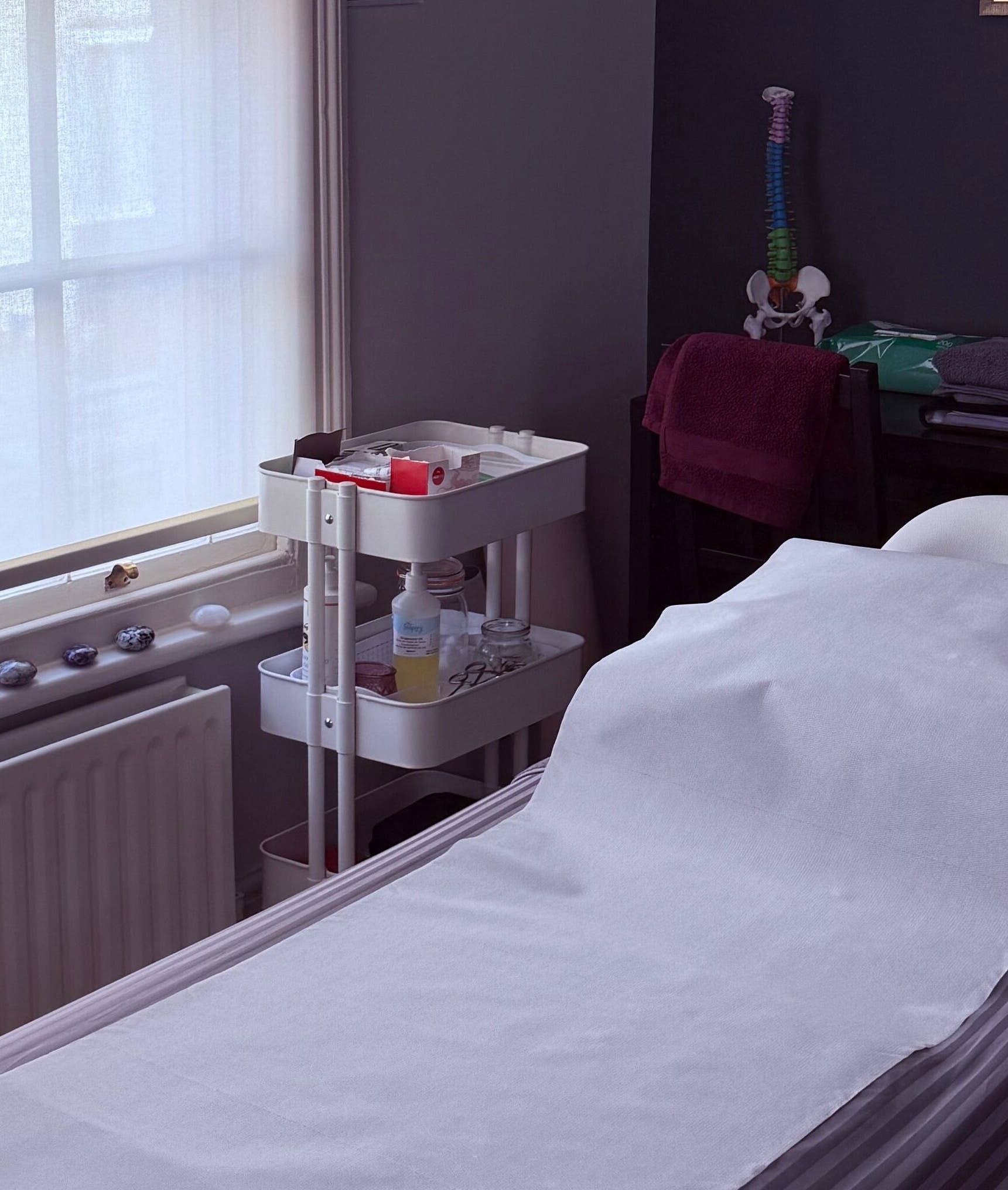 A tranquil massage room at Seeking Stillness Gravesend, Gravesend, England, GB, featuring a comfortable massage bed.