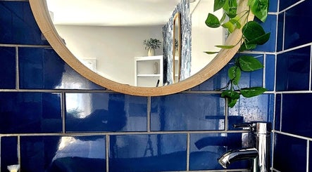 Elegant bathroom at Precision Therapy at Hairmonious Emsworth with vibrant blue tiles in Emsworth, England, GB.