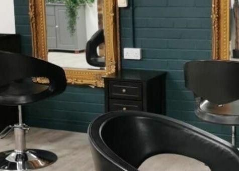 Modern salon chairs and mirrors at Uglee Betties, Carlisle, England, GB, offering a stylish beauty experience.
