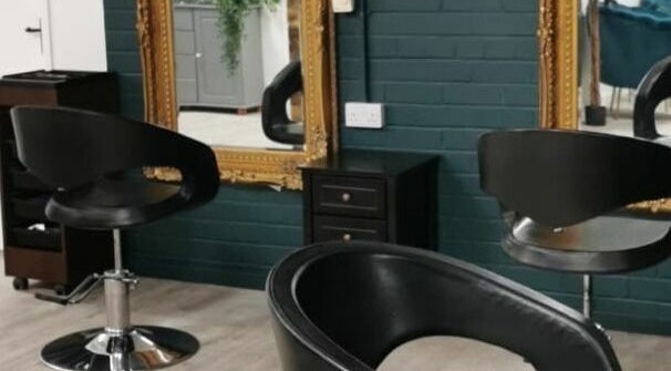 Modern salon chairs and mirrors at Uglee Betties, Carlisle, England, GB, offering a stylish beauty experience.