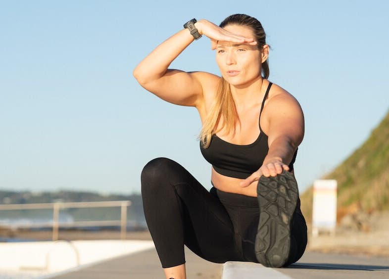 Woman stretching at Megan Roberts - Fertility & Sports Dietitian, Wickham, New South Wales, AU.