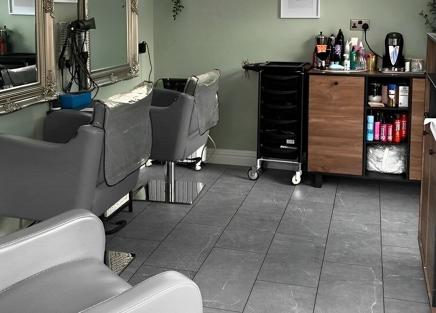 Interior of Reflections by Cheryl in Stafford, England, GB featuring elegant salon chairs and mirrors.