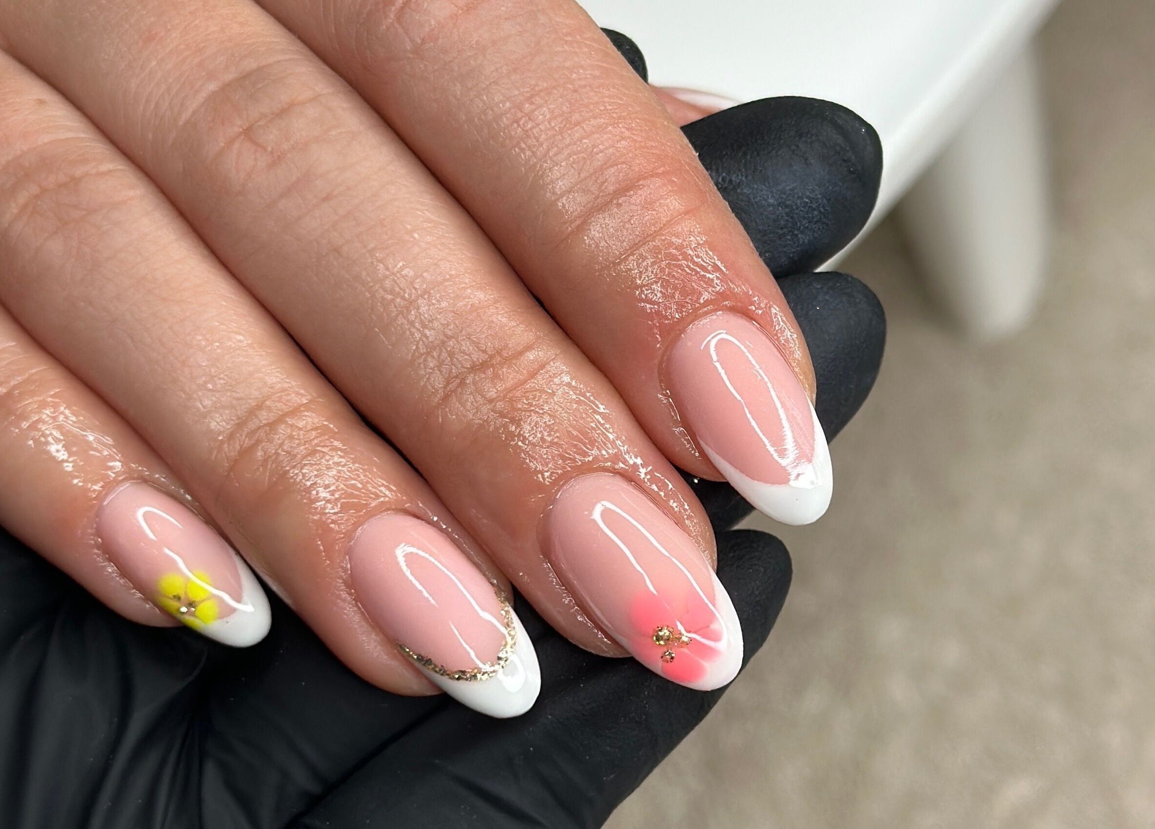 Close-up of elegant nail art with flowers at Livin Beauty Lounge, Purton, England, GB.