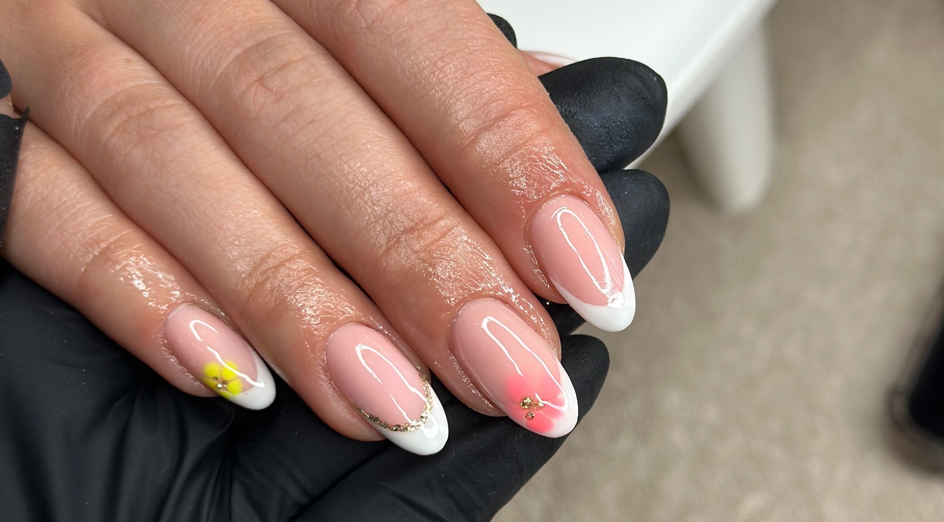 Close-up of elegant nail art with flowers at Livin Beauty Lounge, Purton, England, GB.