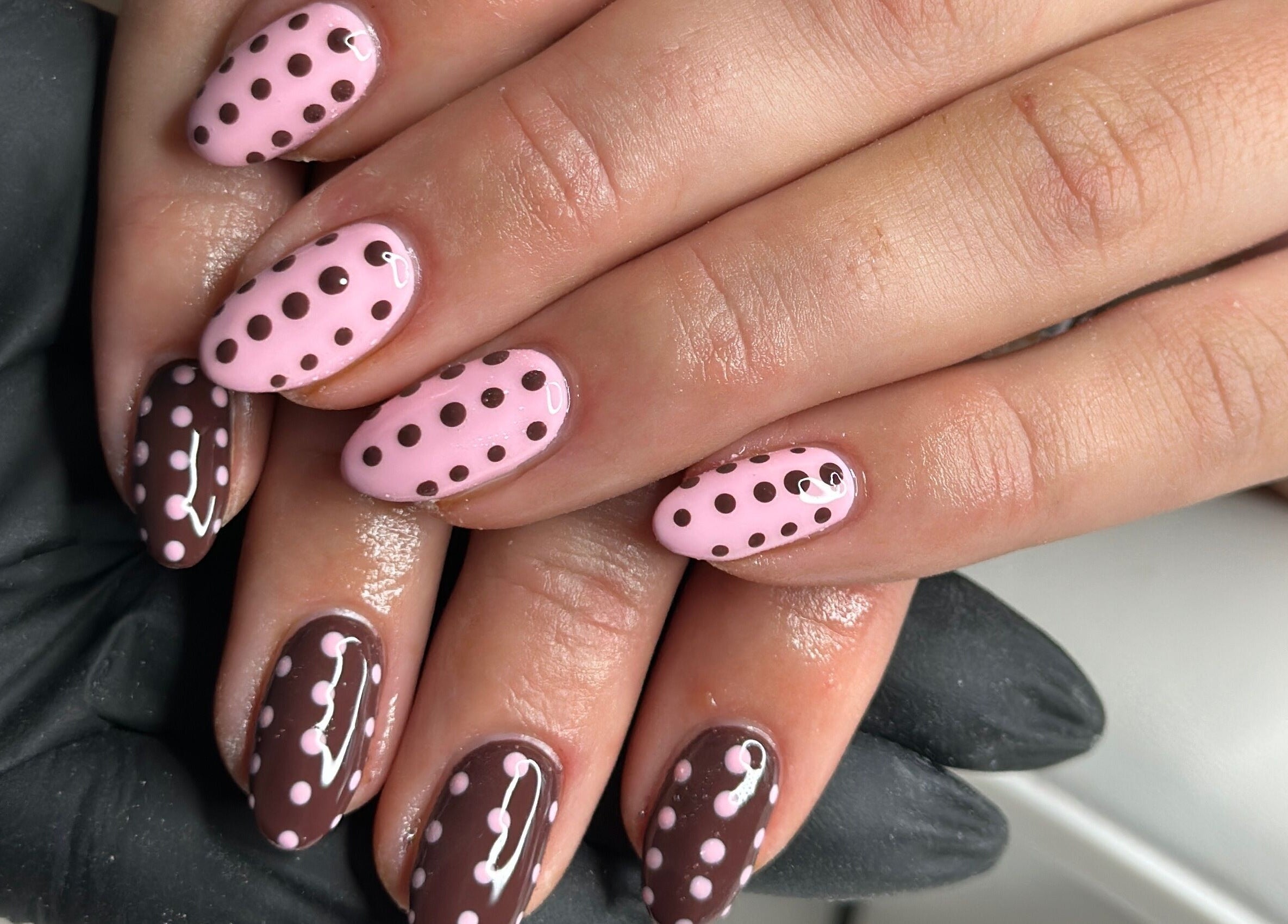 Stylish polka dot nail design at Livin Beauty Lounge, Purton, England, GB, showcasing modern nail art.