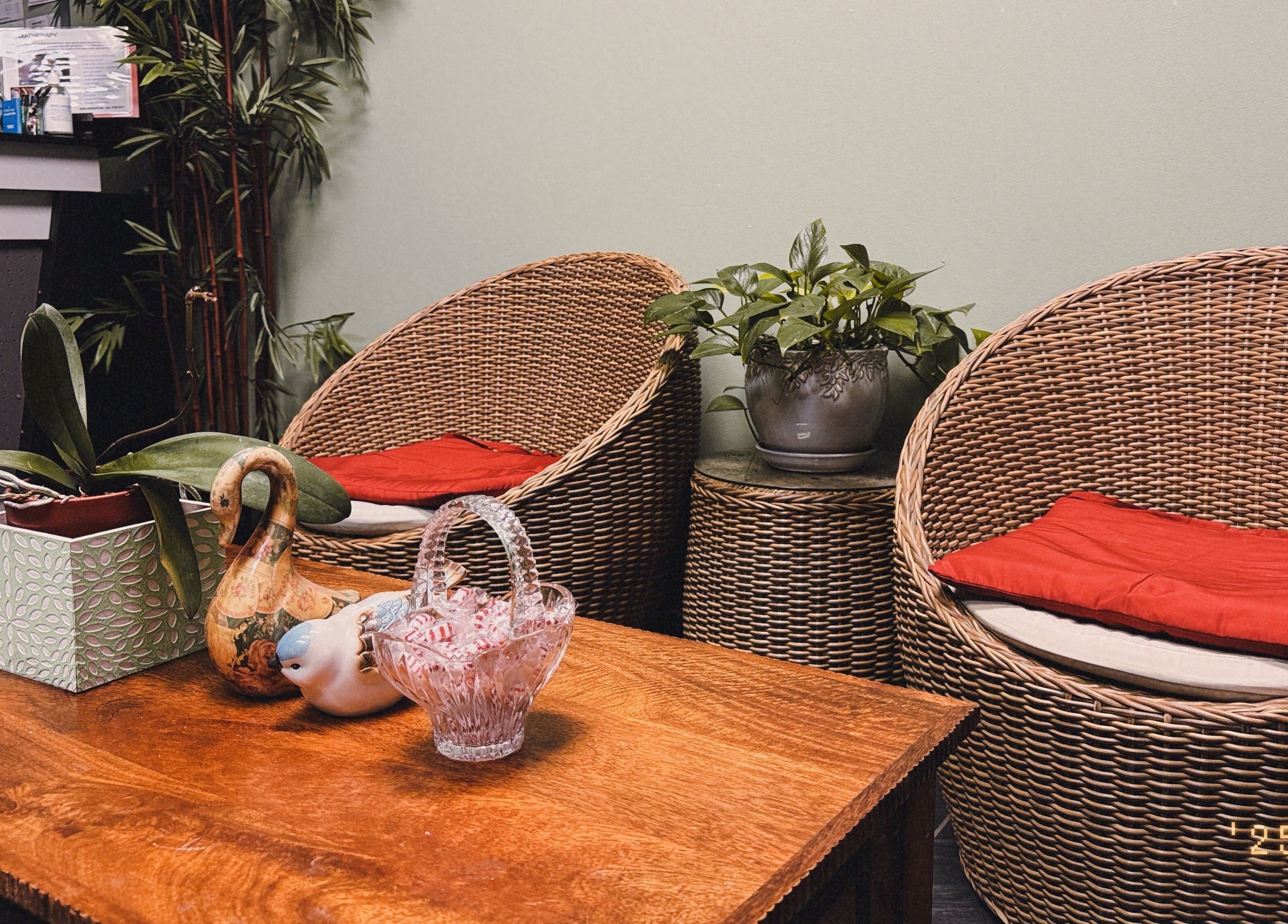 Cozy seating area at Asian Massage in Chesapeake, Virginia, US, featuring wicker chairs and calming decor.