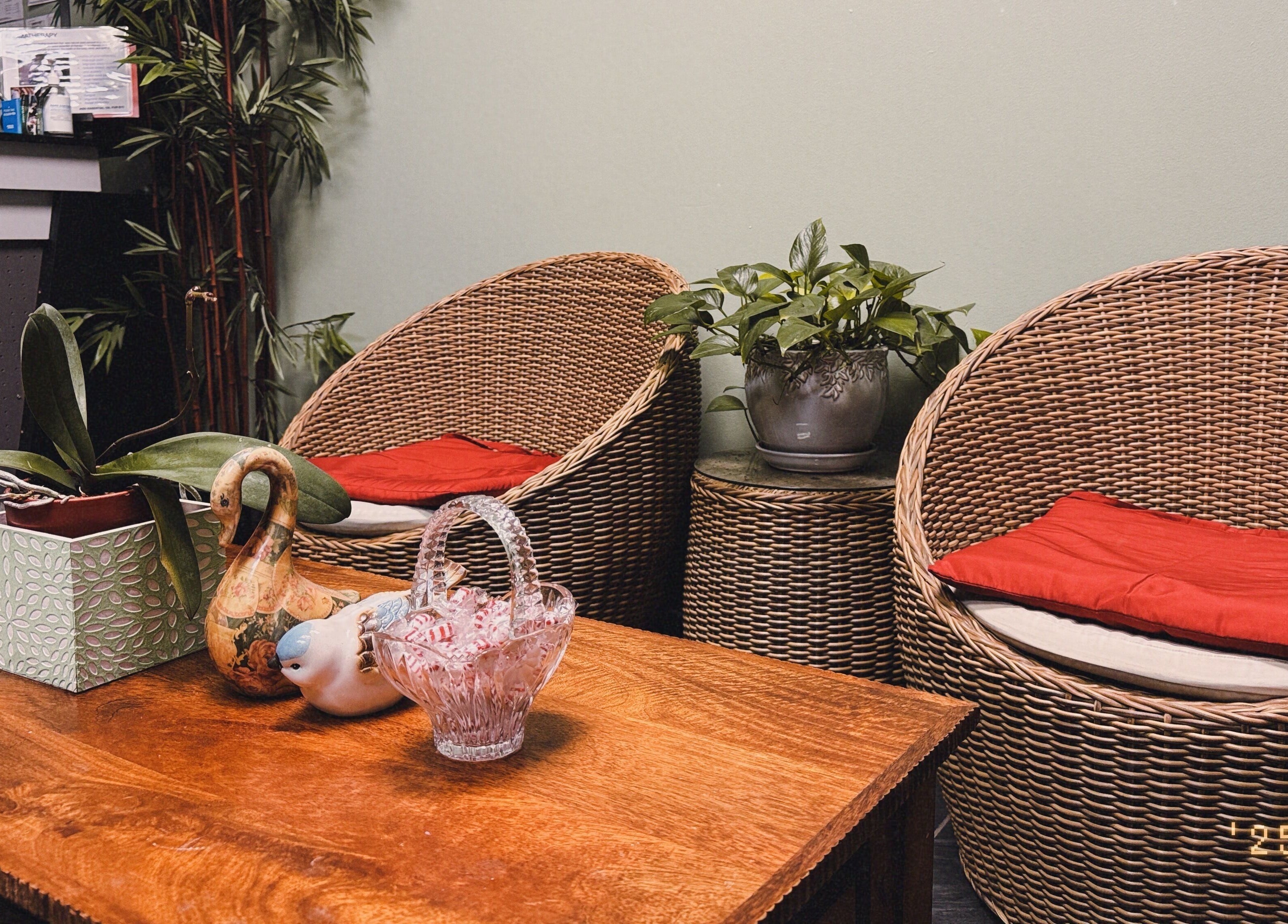Cozy seating area at Asian Massage in Chesapeake, Virginia, US, featuring wicker chairs and calming decor.