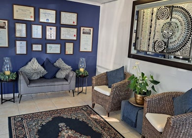 Elegant waiting area with cozy seating at Sharons Massage Studio, Mossel Bay, Western Cape, ZA.