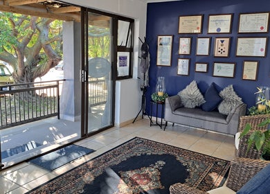 Inviting lobby of Sharons Massage Studio in Mossel Bay, Western Cape, ZA showcasing a comfortable seating area.