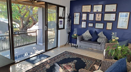 Inviting lobby of Sharons Massage Studio in Mossel Bay, Western Cape, ZA showcasing a comfortable seating area.