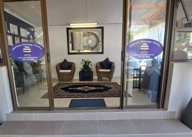 Welcoming entrance of Sharons Massage Studio in Mossel Bay, Western Cape, ZA with cozy seating and decor.