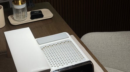 Elegant nail workspace at Tanned Professional in Bury, England, GB showcasing sleek design and modern amenities.