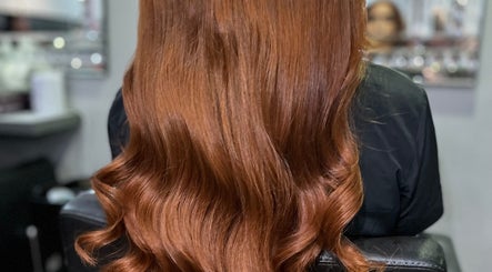 Lustrous wavy red hair styled beautifully at Adele Howarth Hair, Glasgow, Scotland, GB.