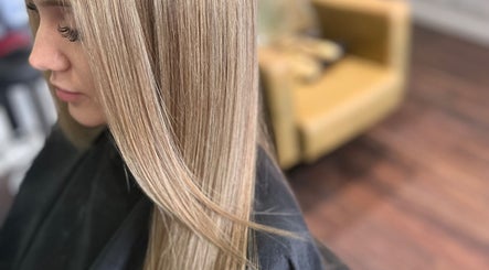 Smooth, sleek hairstyle at Adele Howarth Hair, Glasgow, Scotland, GB, showcasing expert styling.