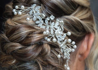 Stylish updo adorned with pearls at Adele Howarth Hair, Glasgow, Scotland, GB.