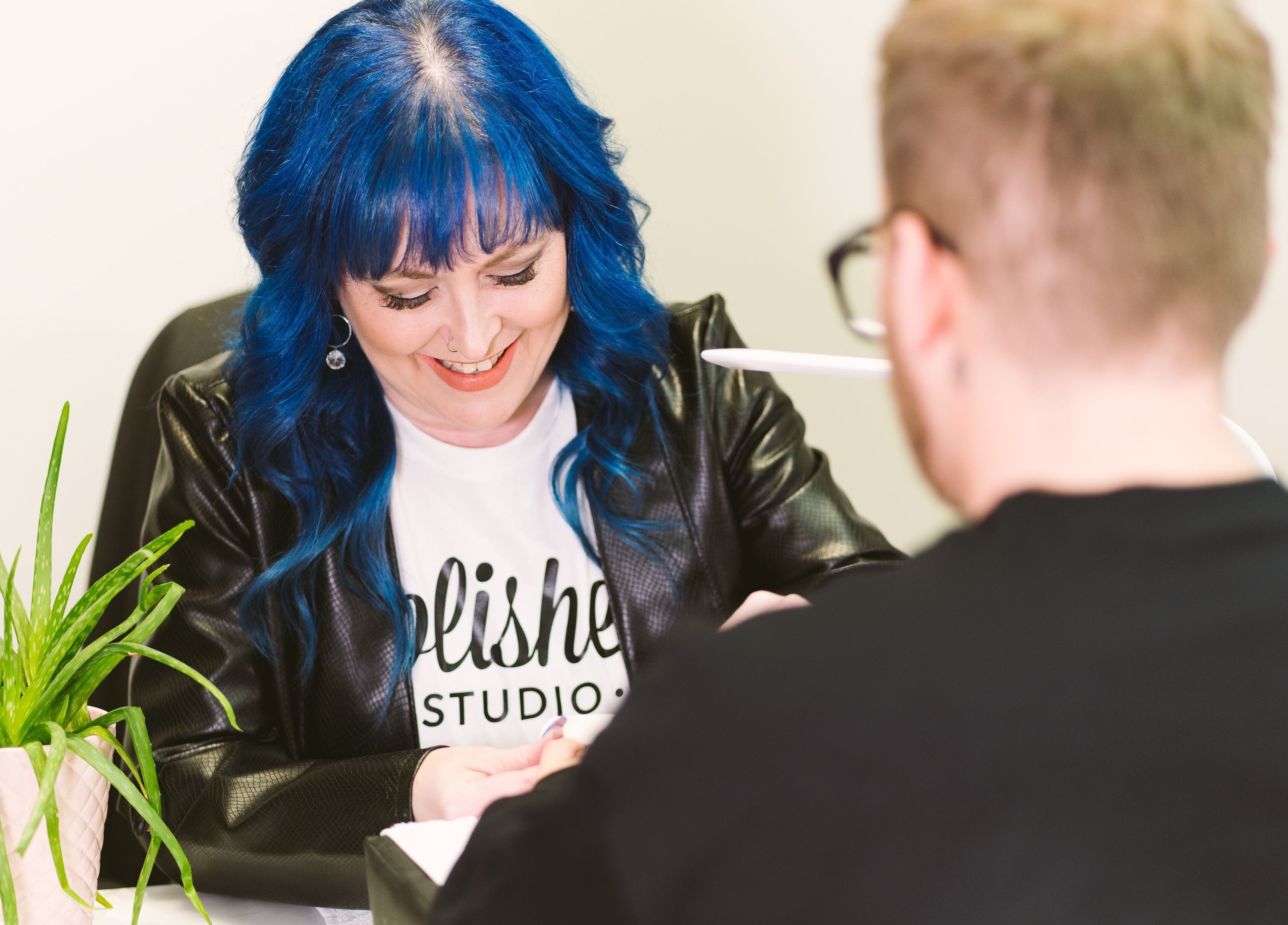 Polished Studio in Torbay, NL, CA offers expert nail services. A stylist perfecting nails.