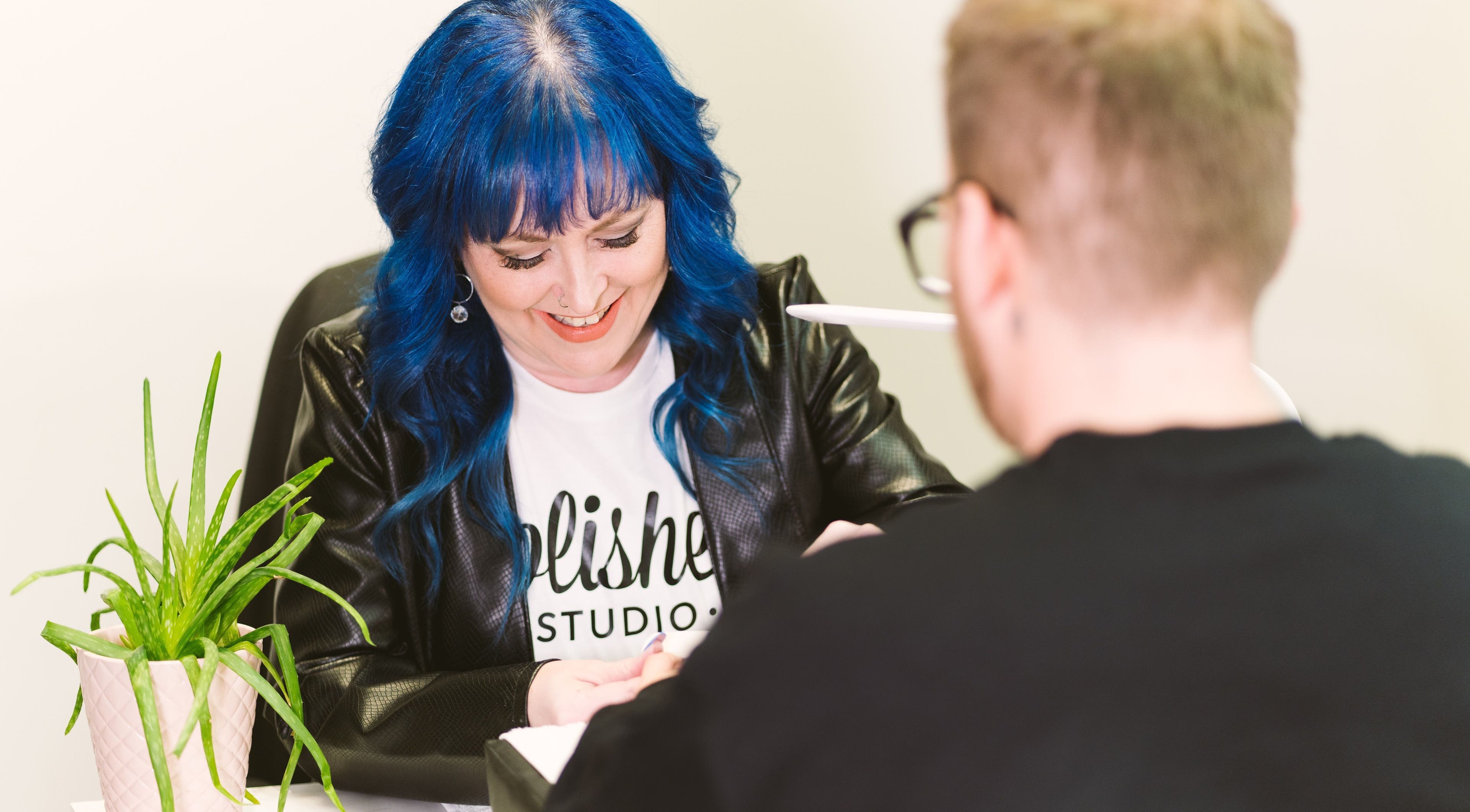 Polished Studio in Torbay, NL, CA offers expert nail services. A stylist perfecting nails.