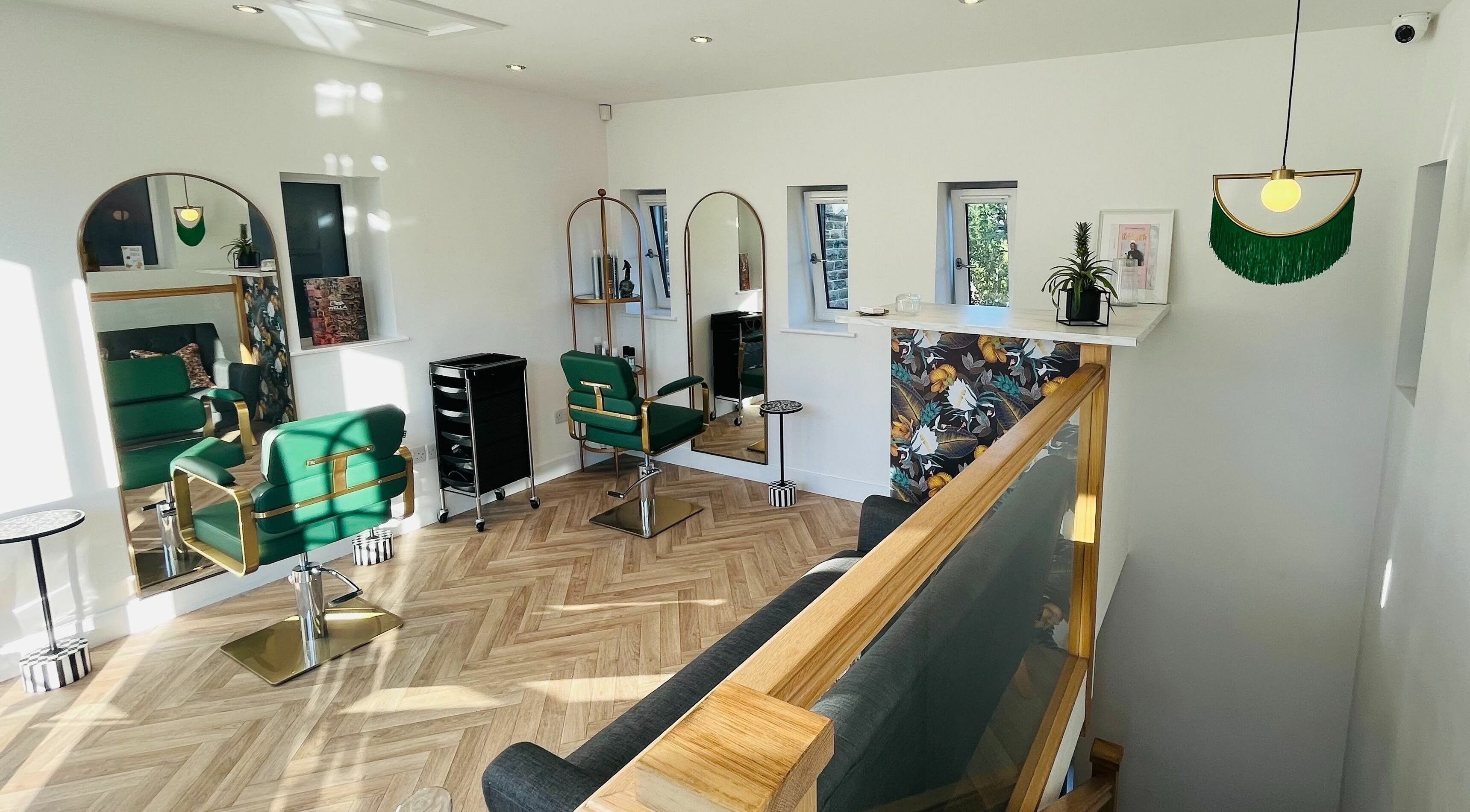 Bright, stylish interior of Meta Salon in Denby Dale, England, GB with elegant chairs and decor.