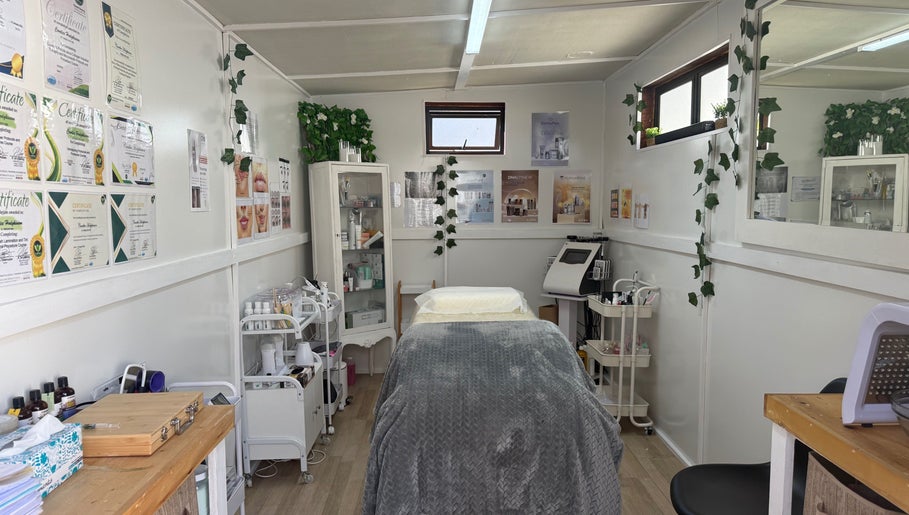 Cozy treatment room at H.O.T - House of Trend in Cape Town, Western Cape, ZA, featuring a comfortable bed and skincare products.