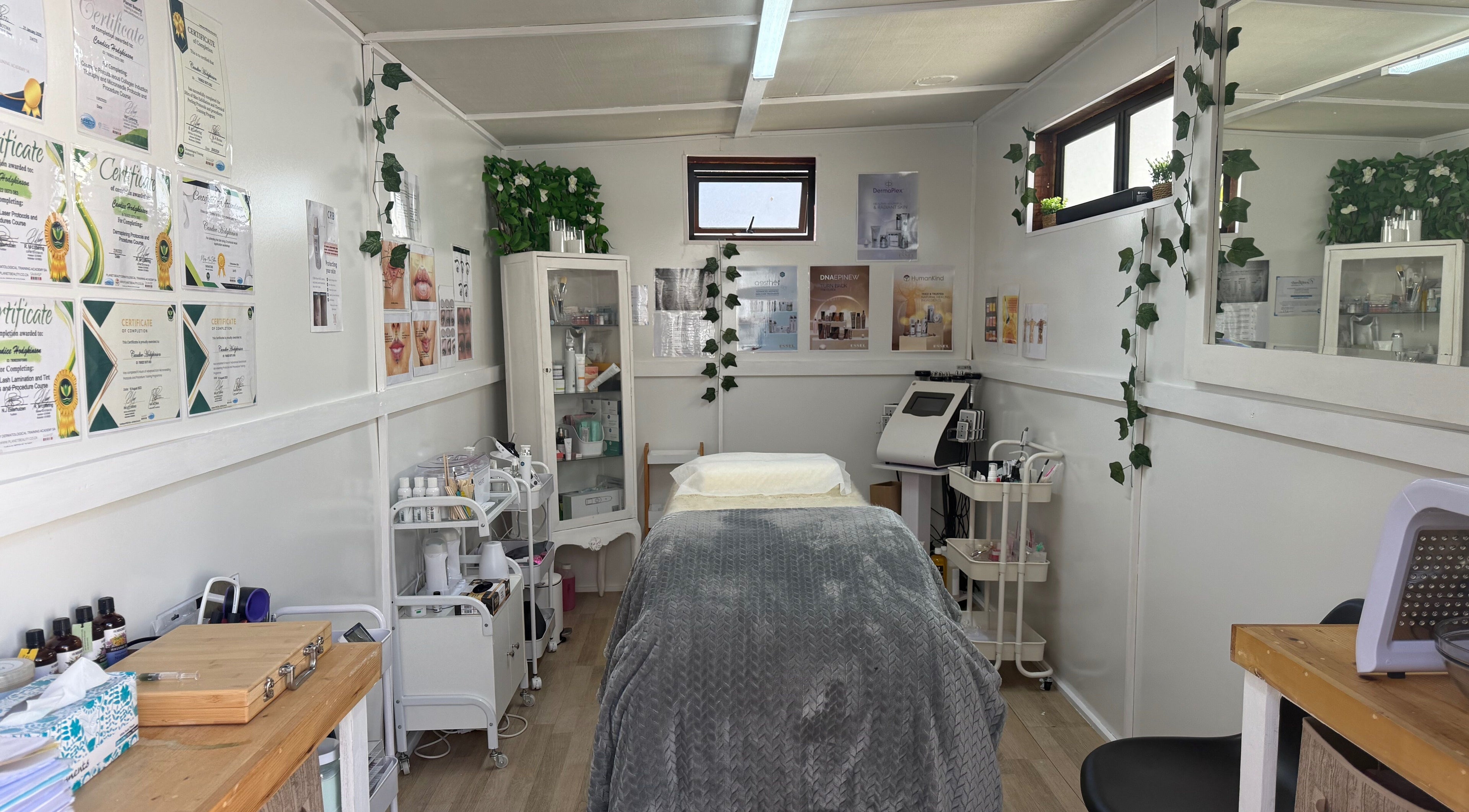 Cozy treatment room at H.O.T - House of Trend in Cape Town, Western Cape, ZA, featuring a comfortable bed and skincare products.