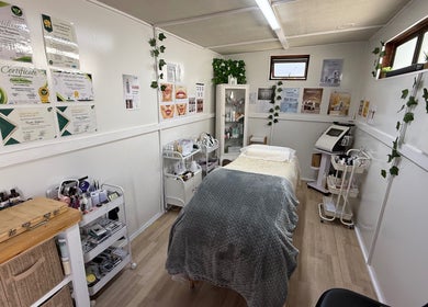 Serene treatment room at H.O.T - House of Trend, Cape Town, Western Cape, ZA, featuring cozy decor and equipment.