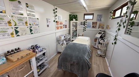 Serene treatment room at H.O.T - House of Trend, Cape Town, Western Cape, ZA, featuring cozy decor and equipment.