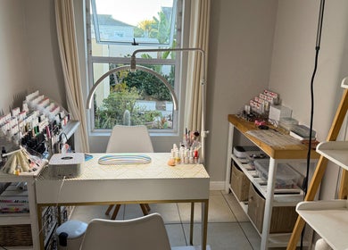 Nail salon setup at H.O.T - House of Trend, Cape Town, Western Cape, ZA. Bright, organized space with polish collection.
