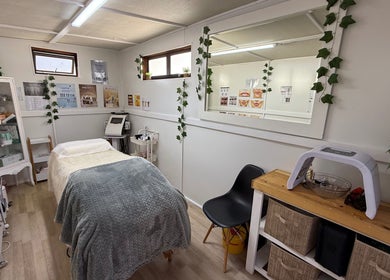 Cozy treatment room at H.O.T - House of Trend, Cape Town, Western Cape, ZA, with modern decor and lush greenery.