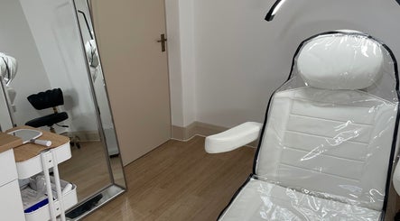Sleek beauty treatment room at LR Skin & Aesthetics, Leicester, England, GB, featuring a comfortable chair and mirror.