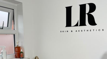 Minimalist decor at LR Skin & Aesthetics, Leicester, England, GB showcasing beauty products and sleek design.