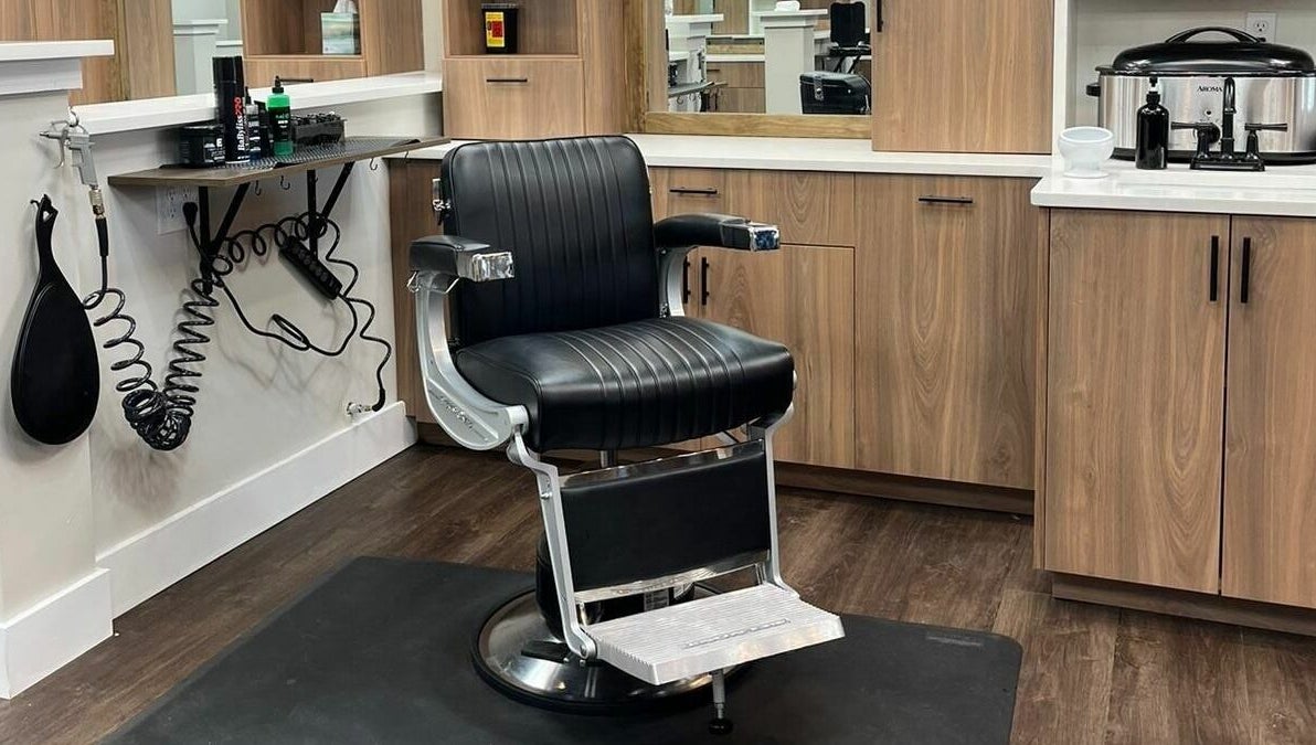 Lux Barbershop's sleek barber chair in Alpharetta, Georgia, US, displaying modern elegance and functionality.