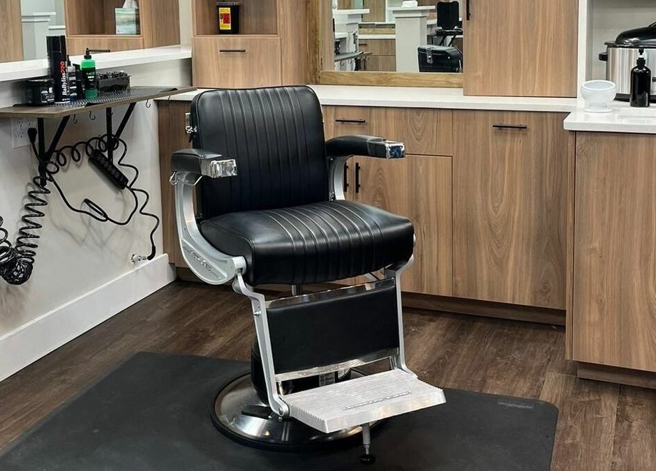 Lux Barbershop's sleek barber chair in Alpharetta, Georgia, US, displaying modern elegance and functionality.