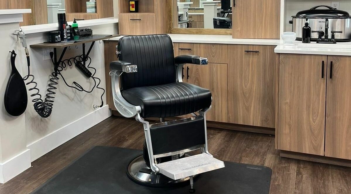 Lux Barbershop's sleek barber chair in Alpharetta, Georgia, US, displaying modern elegance and functionality.