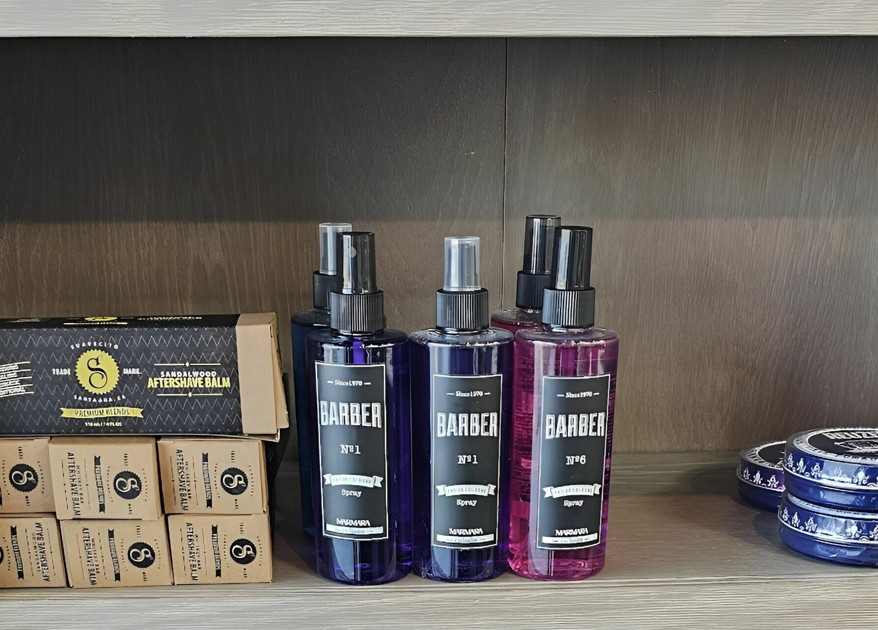 Lux Barbershop grooming products on display in Alpharetta, Georgia, US, featuring aftershave and sprays.