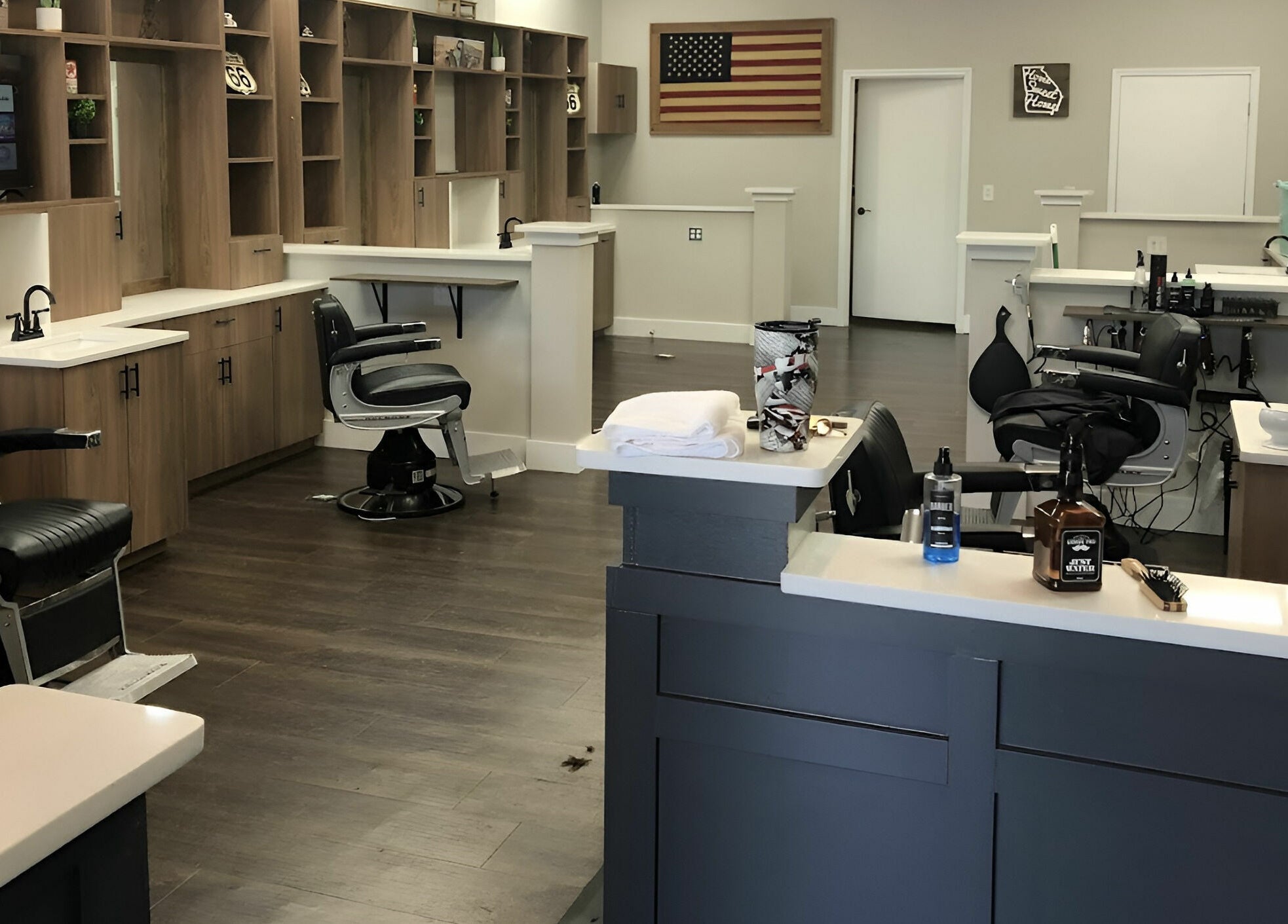 Lux Barbershop interior showcasing sleek black chairs and modern design in Alpharetta, Georgia, US.