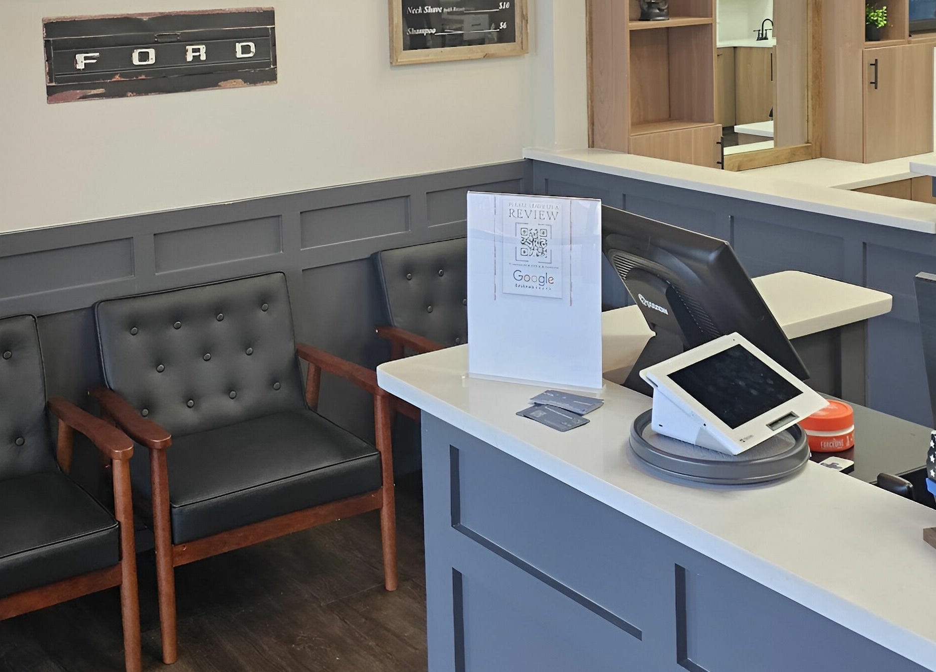 Lux Barbershop's sleek reception area with modern seating in Alpharetta, Georgia, US.